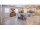 Spacious dining area with tile floors flows into the kitchen with stainless steel appliances at 10281 Sequoia Falls Pl, Las Vegas, NV 89149