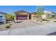 Inviting single-story home featuring a well-manicured front yard and charming curb appeal at 10281 Sequoia Falls Pl, Las Vegas, NV 89149