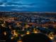 Panoramic aerial view of a vibrant neighborhood and city skyline at twilight at 10313 Jade Point Dr, Las Vegas, NV 89135