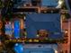 Overhead shot showcases a home with a large pool, courtyard and intricate rooflines, highlighting its unique architectural design at 10313 Jade Point Dr, Las Vegas, NV 89135