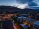 Twilight aerial view of a luxury residential community featuring mountain views and modern home designs at 10313 Jade Point Dr, Las Vegas, NV 89135