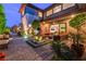 Outdoor patio area with a water feature, stylish seating, pavers, and elegant lighting at 10313 Jade Point Dr, Las Vegas, NV 89135