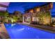 Beautiful backyard view featuring a swimming pool with an outdoor living area under a covered patio at 10313 Jade Point Dr, Las Vegas, NV 89135