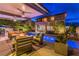 Inviting backyard oasis with a pool, hot tub, fire pit, and covered patio seating, perfect for outdoor entertaining at 10313 Jade Point Dr, Las Vegas, NV 89135