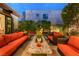 Relaxing outdoor living space with comfortable seating, a water feature, and well-manicured greenery at 10313 Jade Point Dr, Las Vegas, NV 89135