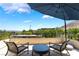 Inviting balcony with comfortable seating and shade, offering scenic neighborhood and mountain views at 10313 Jade Point Dr, Las Vegas, NV 89135