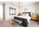 Bedroom featuring modern design, neutral color scheme, ample natural light, and stylish furnishings at 10313 Jade Point Dr, Las Vegas, NV 89135