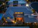 Aerial view of a modern home featuring a private courtyard with stylish seating, and manicured landscaping at 10313 Jade Point Dr, Las Vegas, NV 89135