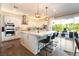 Spacious kitchen with a large island, stainless steel appliances, and a view to the outdoor patio at 10313 Jade Point Dr, Las Vegas, NV 89135