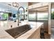 Modern kitchen features a large stainless steel refrigerator and a sink with a spring faucet at 10313 Jade Point Dr, Las Vegas, NV 89135