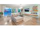 Modern living room featuring hardwood floors, stylish decor, and an inviting fireplace at 10313 Jade Point Dr, Las Vegas, NV 89135