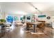 Open-concept living space combining a dining area and living room, ideal for modern entertaining and relaxation at 10313 Jade Point Dr, Las Vegas, NV 89135