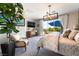 Serene main bedroom with sitting area, contemporary lighting, and a private balcony at 10313 Jade Point Dr, Las Vegas, NV 89135