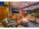 Inviting outdoor space with a fire pit, built-in bar, and seating, perfect for relaxing or entertaining at 10313 Jade Point Dr, Las Vegas, NV 89135