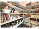 Organized pantry with white shelving storing a variety of food and household items at 10313 Jade Point Dr, Las Vegas, NV 89135
