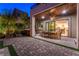 Charming outdoor patio with a dining table, ceiling fan, and comfortable seating, ideal for relaxation at 10313 Jade Point Dr, Las Vegas, NV 89135