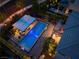 Elevated twilight shot featuring a luxurious pool and covered outdoor living space at 10313 Jade Point Dr, Las Vegas, NV 89135
