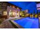 Inviting backyard with a sparkling pool, dining area, and landscaped patio, perfect for outdoor entertaining at 10313 Jade Point Dr, Las Vegas, NV 89135