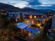 Luxury home featuring an infinity pool, spa, a covered patio, and lush landscaping with mountain views at 10313 Jade Point Dr, Las Vegas, NV 89135