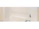 A close-up shot of the shower with white tiles, chrome showerhead, and handle at 10313 Jade Point Dr, Las Vegas, NV 89135
