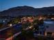 Scenic street view showcases lush landscaping and modern architecture under the twilight sky at 10313 Jade Point Dr, Las Vegas, NV 89135