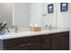 Modern bathroom with dual sinks, contemporary cabinetry, and elegant fixtures for convenience at 11813 Pippa Ave, Las Vegas, NV 89138