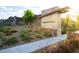 Community entrance with stone signage, decorative landscaping, and a paved walkway at 11813 Pippa Ave, Las Vegas, NV 89138
