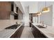 Gourmet kitchen featuring granite countertops, a tile backsplash, and stainless steel appliances at 11813 Pippa Ave, Las Vegas, NV 89138