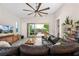 Inviting living room featuring a comfortable sectional sofa and access to an outdoor patio at 11813 Pippa Ave, Las Vegas, NV 89138