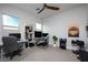 Spacious home office with dual workstations, ceiling fan and natural light from large window at 11813 Pippa Ave, Las Vegas, NV 89138
