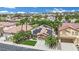 Nevada home featuring solar panels surrounded by lush landscaping in a well-kept neighborhood at 1324 European Dr, Henderson, NV 89052