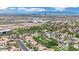 Stunning aerial perspective of a well-planned community and Las Vegas skyline at 1324 European Dr, Henderson, NV 89052