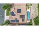 An aerial view of a home with solar panels and a refreshing swimming pool at 1324 European Dr, Henderson, NV 89052