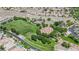 Aerial view showcasing the community park including soccer fields, tennis courts, and green spaces at 1324 European Dr, Henderson, NV 89052