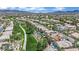 Scenic aerial view of community with walking path and desert landscape at 1324 European Dr, Henderson, NV 89052