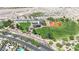 Aerial view of community park with baseball field, green spaces, picnic areas, and playground at 1324 European Dr, Henderson, NV 89052