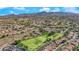 Community aerial showing the neighborhood park with tennis courts and green spaces in a residential area at 1324 European Dr, Henderson, NV 89052