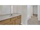 Bathroom featuring a vanity with light wood cabinets and a large mirror at 1324 European Dr, Henderson, NV 89052