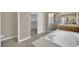 Bathroom features soaking tub, walk-in shower, and a spacious walk-in closet at 1324 European Dr, Henderson, NV 89052