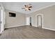 Bedroom featuring hardwood floors, neutral decor, and a ceiling fan at 1324 European Dr, Henderson, NV 89052