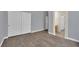 Bedroom featuring hardwood floors, base molding, neutral paint, and a large sliding door closet at 1324 European Dr, Henderson, NV 89052