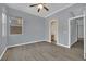 Bedroom features include a ceiling fan, hardwood floors, and natural light at 1324 European Dr, Henderson, NV 89052
