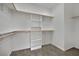 Walk-in closet with built-in shelves and racks, maximizing storage and organization at 1324 European Dr, Henderson, NV 89052