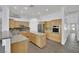 Well-appointed kitchen featuring wooden cabinets, stainless steel appliances, and granite countertops at 1324 European Dr, Henderson, NV 89052