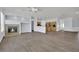 Open-concept living area showcasing a fireplace and a partial view of the kitchen at 1324 European Dr, Henderson, NV 89052