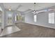 Spacious living room featuring wood floors, tray ceilings, and large windows for ample natural light at 1324 European Dr, Henderson, NV 89052