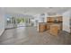 Bright living room with a fireplace, access to a pool, and an open layout to the kitchen at 1324 European Dr, Henderson, NV 89052
