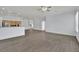 Open living space highlighting wood floors and seamless connection to the kitchen at 1324 European Dr, Henderson, NV 89052