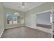Inviting office space with three large windows, wood floors, and neutral green paint at 1324 European Dr, Henderson, NV 89052