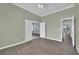 Another view of the office showcasing the doorframe, paint color, and flooring at 1324 European Dr, Henderson, NV 89052